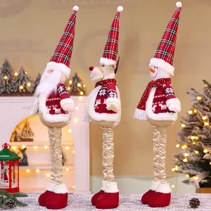 Close-up of telescopic Christmas gnome trio with red plaid hats and gold legs