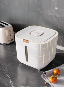 Detail of food storage container with a transparent window on a marble countertop