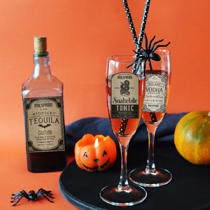 Halloween bottle labels featuring Midnight Tequila and Snakebite Tonic on a festive background