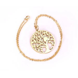 Macro detail of golden Tree of Life pendant featuring owl with rhinestone eyes on O-chain