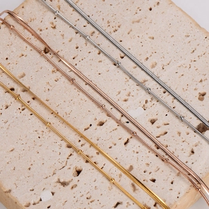 Minimalist double layer snake chain bracelet with beads in gold, rose gold and silver