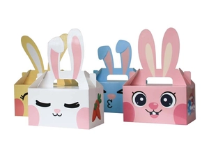 Macro shot of 4-color cartoon Easter bunny gift boxes with 3D ears and holiday patterns