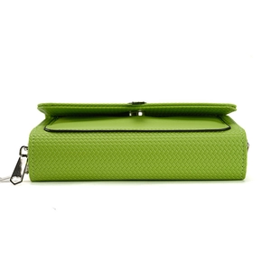Grass green woven pattern cross-body phone bag with heart zipper detail and fold-over flap