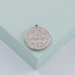 Round silver titanium steel pendant with religious embossed patterns and holy inscriptions
