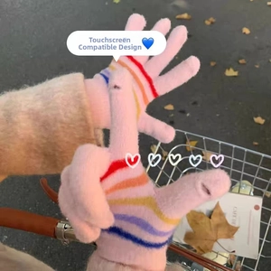 Detailed close-up of pink knitted touchscreen gloves with rainbow striped fingertips