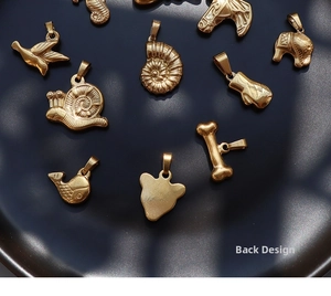 Collection of 18K gold plated animal pendants showing smooth back and front details