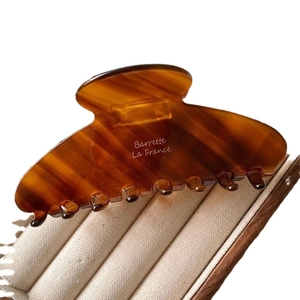 Elegant amber tortoiseshell acetate hair claw clip with Barrette La France white lettering