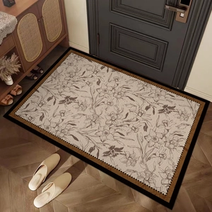 French vintage PVC entryway mat with beige floral pattern on wooden floor