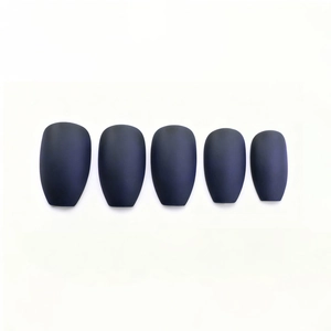 Macro shot of 5 pieces of matte dark blue coffin ballet nails on a white background