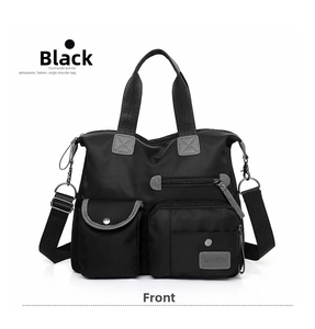 Detail of black oxford fabric tote with functional front pockets and grey brand logo