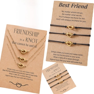 Detail of adjustable Yin Yang braided bracelet and heart knot necklace on gift card
