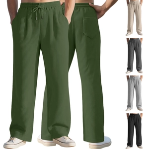 Detailed view of striped corduroy texture and drawstring waistband on men's casual pants