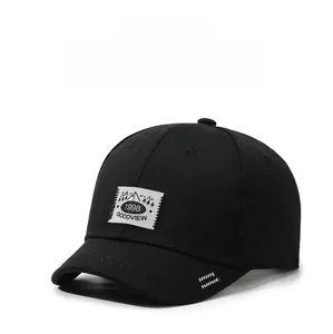 Detailed view of the black cotton baseball cap with a white 1998 lettered patch