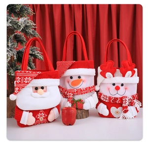 Three festive Christmas gift bags with Santa, snowman, and reindeer in soft knit texture
