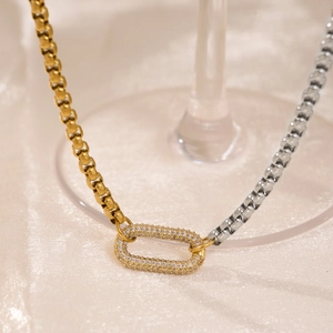Close-up of 18k gold and silver corn chain with U-shaped crystal paved link