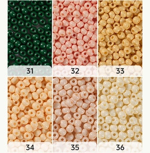 Macro shot of 4mm glass seed beads in six assorted oil painting colors for DIY jewelry