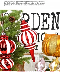 Close-up of red and white striped Christmas ornaments hanging on a festive tree branch