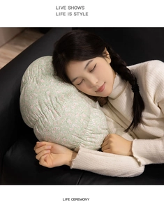 Floral print cylinder plush pillow shown as a comfortable side sleeper body cushion