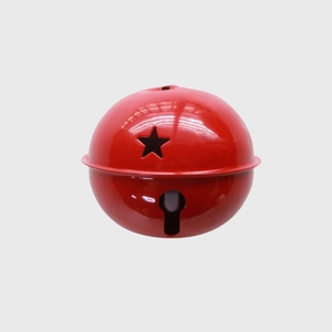 Close-up of a red metal 8cm Christmas bell with a star cutout for tree decoration