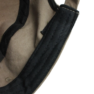 Detailed view of khaki cotton flat top military cap showing black sweatband and stitching