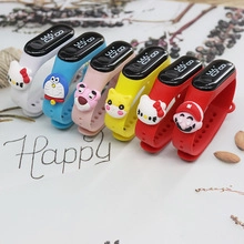 Close-up of colorful nylon LED watches with various 3D cartoon character ornaments