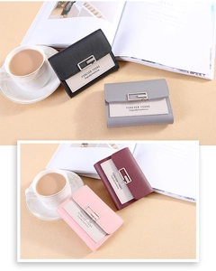 Close-up of stylish PU leather wallets with silver G-buckle and elegant pebble texture