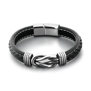 Men's black braided leather bracelet with a metal knot detail and magnetic clasp