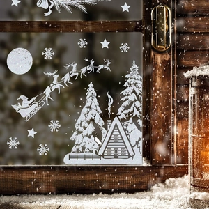 White Christmas window stickers featuring Santa, reindeer, and snowflakes for glass decor