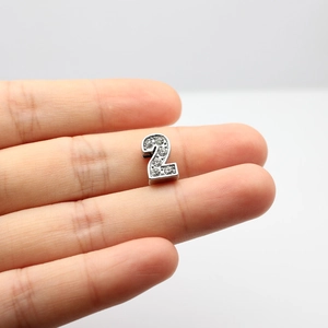 Close-up of silver number 2 charm with white rhinestones for DIY bracelet making