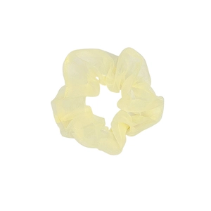 Sheer pale yellow organza scrunchie with pleated texture on white background
