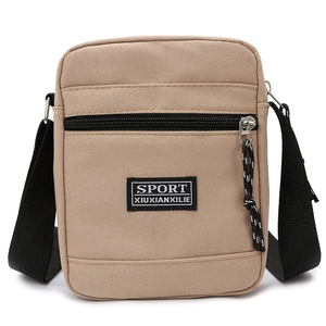 Minimalist khaki nylon shoulder bag with adjustable strap and front zipper pocket