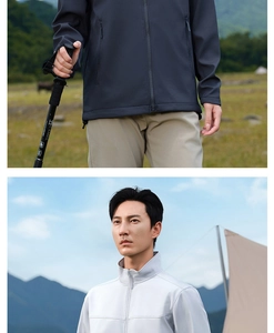 Detail of waterproof softshell jacket with stand collar and trekking pole for hiking