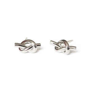 Minimalist silver knot stud earrings in polished stainless steel for a stylish look