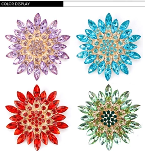 Color display of crystal flower brooches in purple, blue, red and green tones