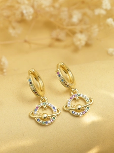 Exquisite golden planet earring with rainbow cubic zirconia pave on a soft warm background