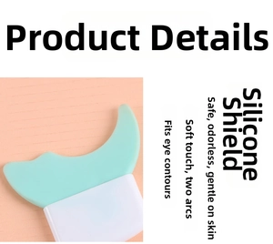 Close-up of mint green silicone makeup shield with dual-curve design for eyeliner