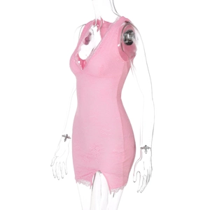 Detail view of pink lace bodycon dress showing intricate floral patterns and split hem