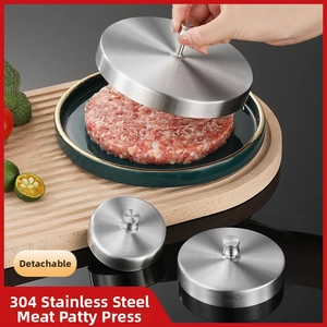 Close-up of 304 stainless steel meat press molding a burger patty on a tray