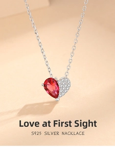 Close-up of S925 silver heart necklace with red ruby gemstone and white zircon pavé