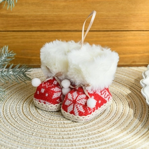 Red knit Christmas boots ornament with white faux fur trim and hanging ribbons
