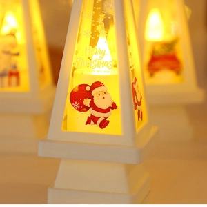 Detail view of white Christmas lantern with warm LED light and Santa Claus printing