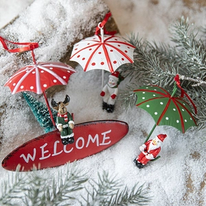 Christmas iron parachute ornaments with Santa, snowman, and reindeer on snowy branches