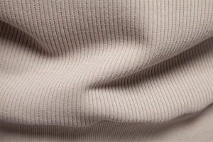 Close-up of beige ribbed knit fabric showing the soft texture of the men's zipper sweatshirt