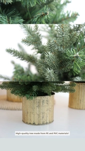 Detail of premium PE and PVC mixed material Christmas tree in a vintage gold metal pot