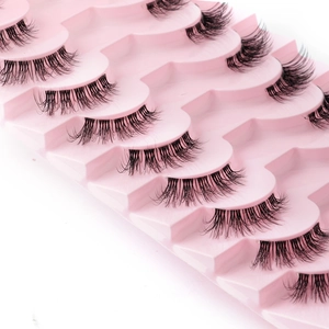 Detail view of multi-pair black natural false eyelashes on a pink tray base