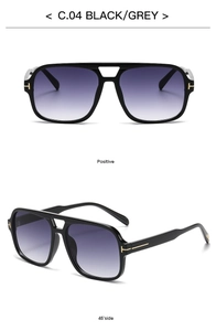 Details einer Pilot-Sonnenbrille mit Verlaufsgläsern und goldenen T-Metall-Akzenten