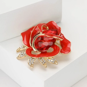 Elegant gold alloy red rose brooch featuring an enamel finish and water drop gemstone