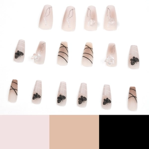 Pink gradient coffin press-on nails with black butterfly patterns and 3D charms