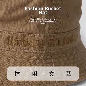 Macro detail of Urban Aurora embroidery on khaki washed cotton fisherman hat