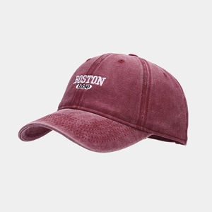 Detailed close-up of the vintage washed fabric texture and Boston embroidery on the cap